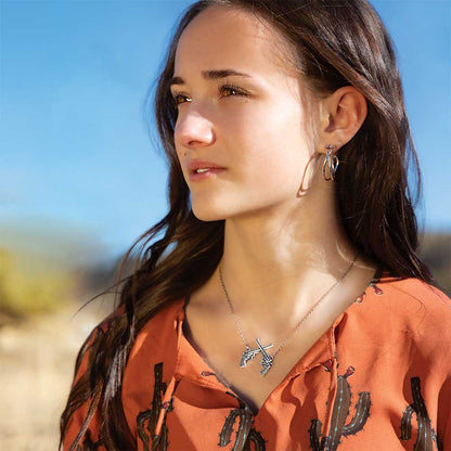 ER5870 | MONTANA SILVERSMITH DARING CROSSED HOOP EARRINGS